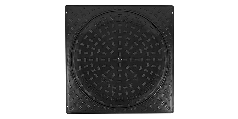 Black manhole cover on a white background