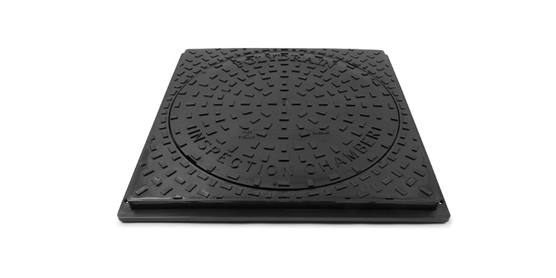 Black square manhole cover with textured surface on a white background