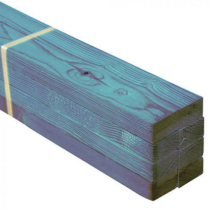 A bundle of blue treated timber battens, tied together, with a visible wood grain and green tint.